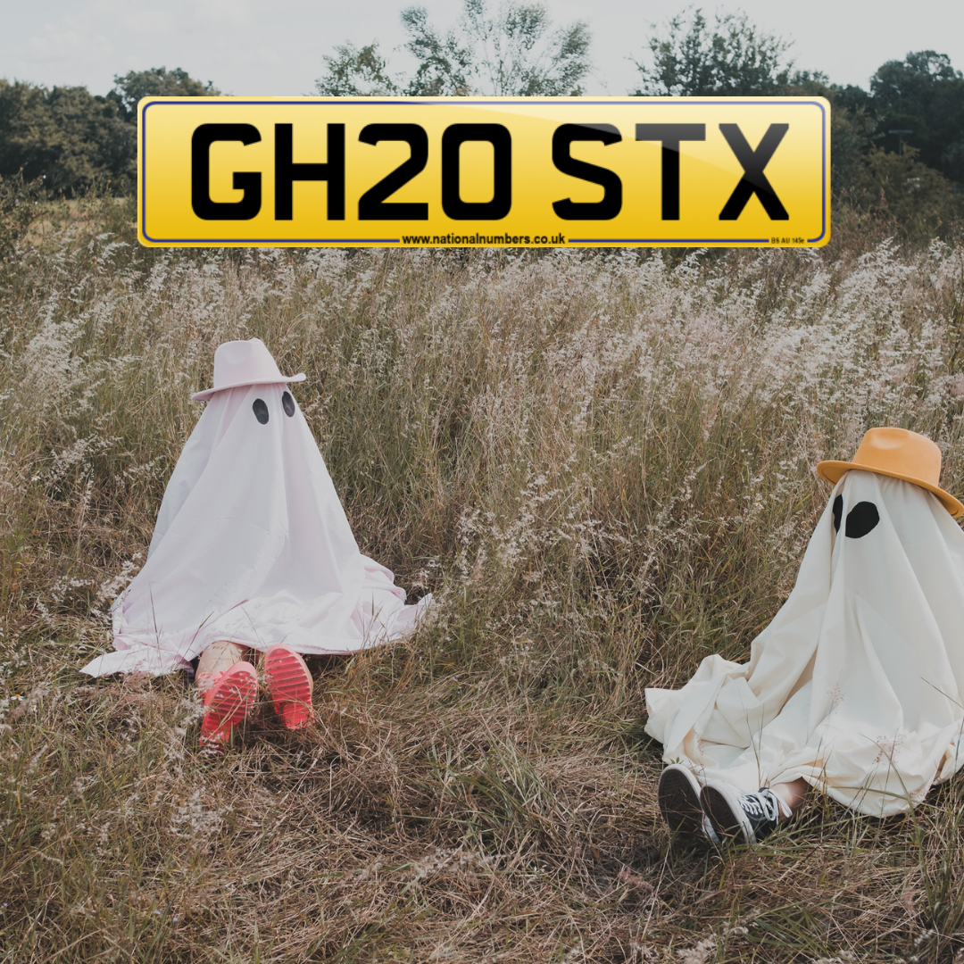 Two children sitting with gghost sheet costumers on and GH20 STX registration over front