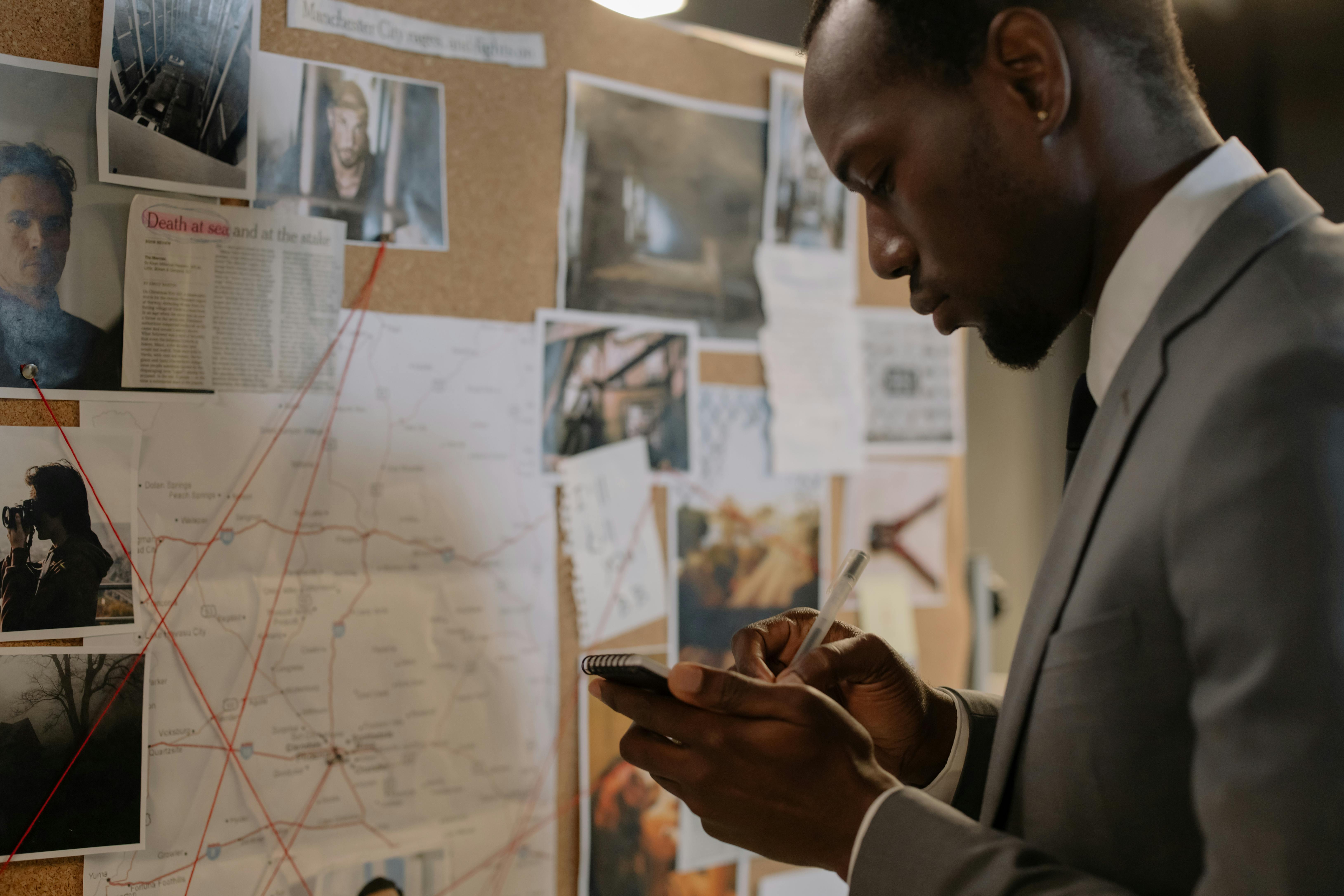 Police investigator looking at police crime board