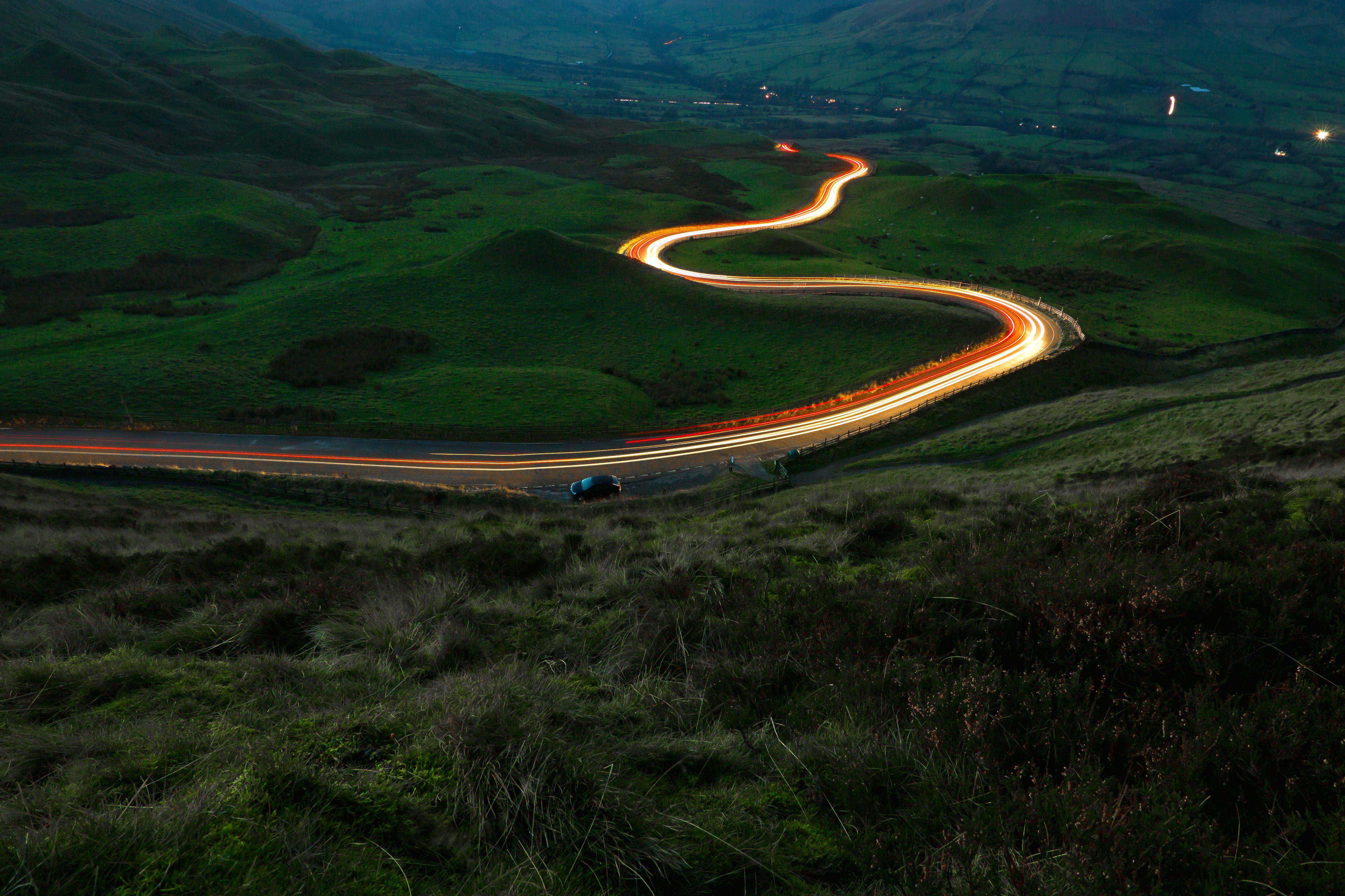 Winding British road in countryside with lights