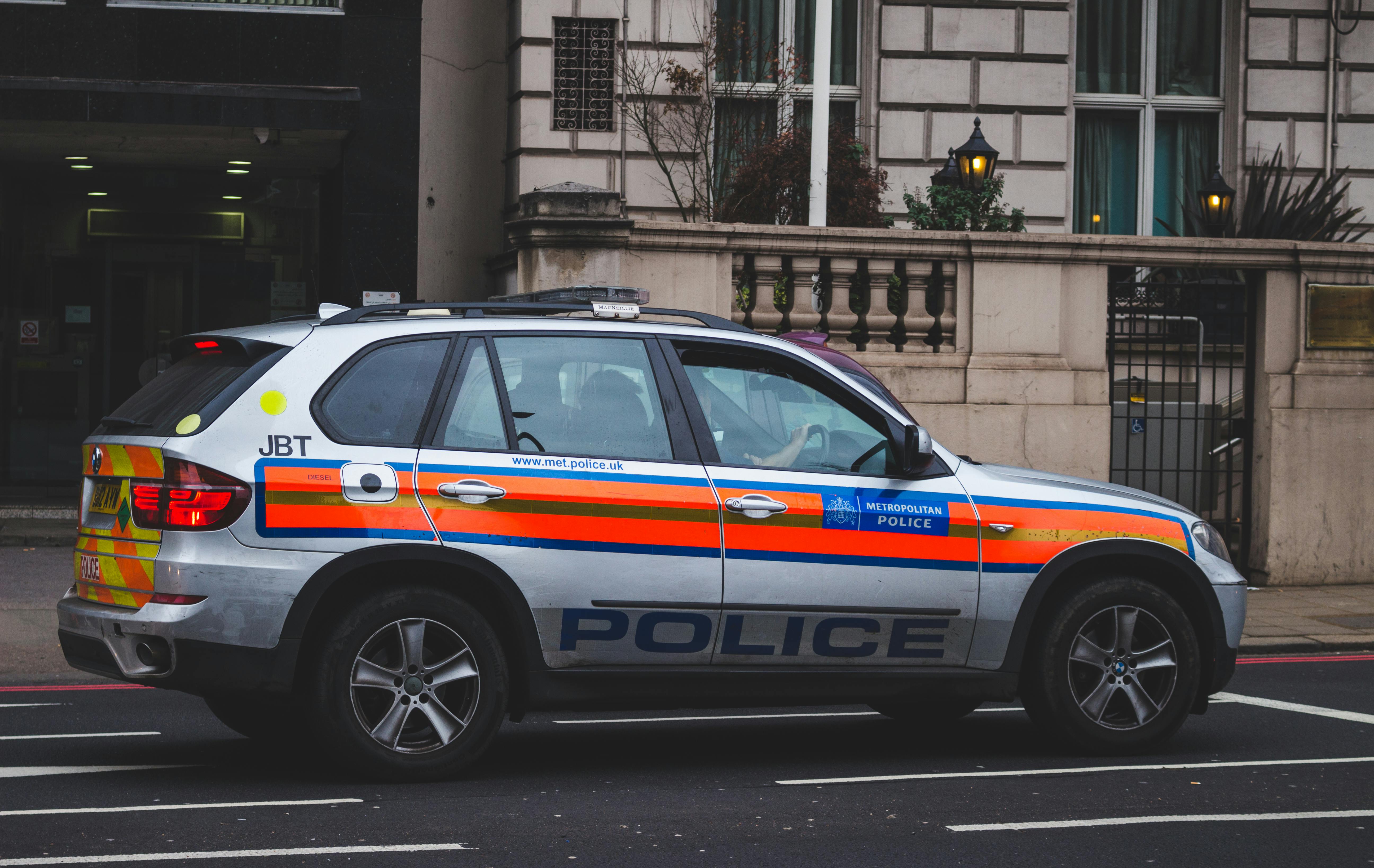UK police car driving in city